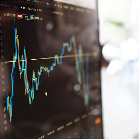 Blue and yellow graph on stock market monitor